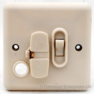 MK switched fused spur unit with flex outlet hole