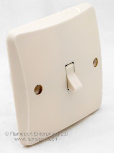 Old single gang MK light switch, angled view