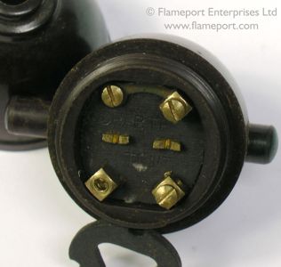 Bakelite pendant switch opened, two halves and a flex grip disc
