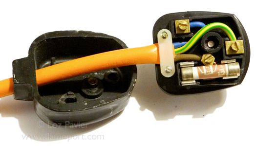Interior of a black rubber 13A Duraplug with 3 core orange flex and Ever Ready fuse 
