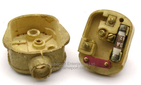 Interior of a horribly dirty and yellowed BS1363 plug