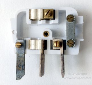 Interior view of a Britmac 13A plug with three in line flat pins