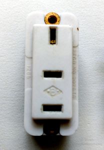 Front of a Britmac non-standard flat blade socket