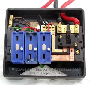 Interior view of a 3-way brown plastic Wylex fuse box