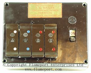 Four fuses in a brown Wylex fuse box